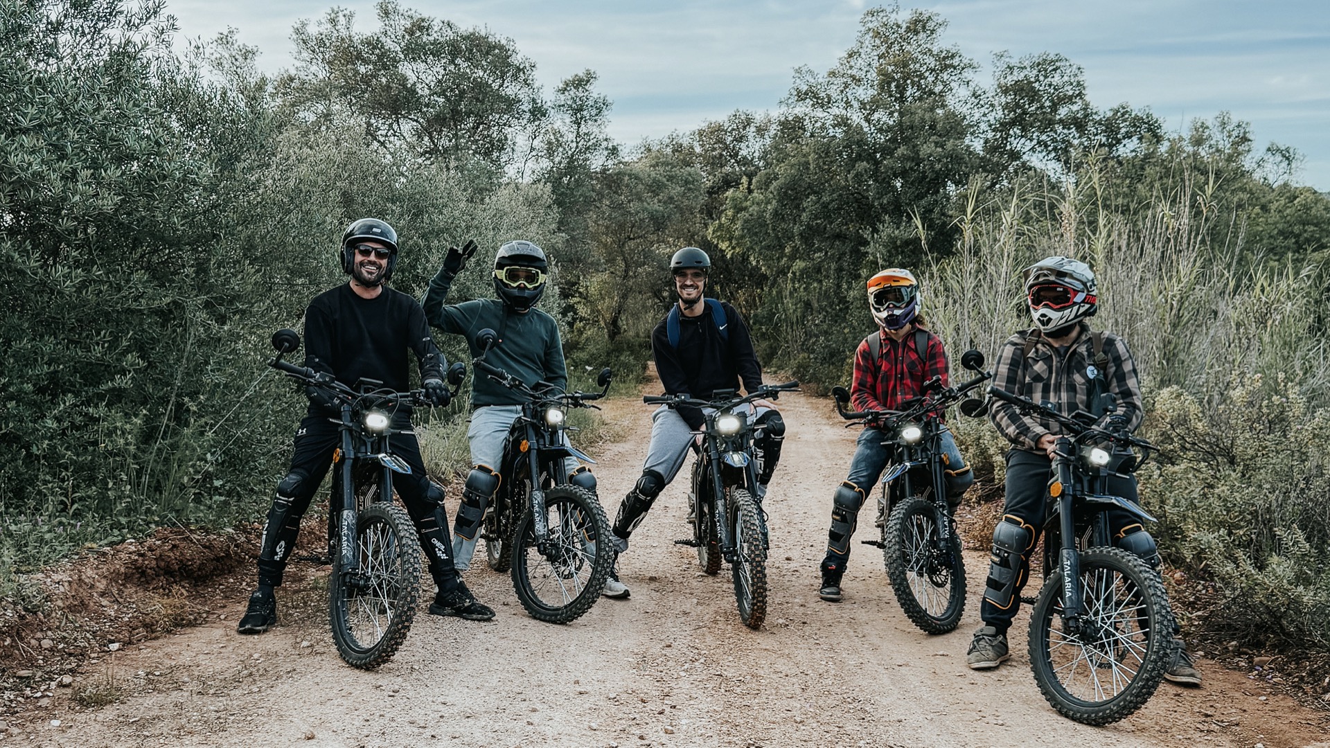 E-bike riders crossing river trail Paderne - Ewheelo adventure tours Algarve